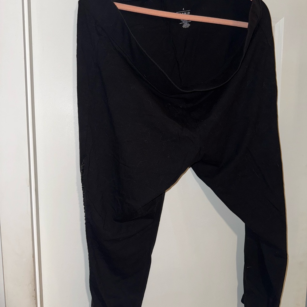 Torrid Black Leggings with woven pleather stitching down the sides.